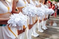 Cheerleaders in white Uniform Holding Pom-Poms. Close up . football championship Royalty Free Stock Photo
