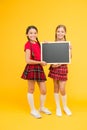 Cheerleading classes. School girls cute pupils red uniform hold blackboard copy space. School announcement concept Royalty Free Stock Photo