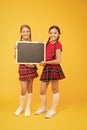 Cheerleading classes. School girls cute pupils red uniform hold blackboard copy space. School announcement concept Royalty Free Stock Photo