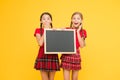 Cheerleading classes. School schedule. School girls cute pupils red uniform hold blackboard copy space. School