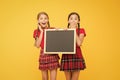 Cheerleading classes. School schedule. School girls cute pupils red uniform hold blackboard copy space. School