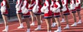 Cheerleaders cheering at a high school football game