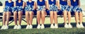 Cheerleading Squad Sitting on Bench