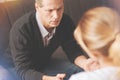 Cheerless adult man visiting a psychologist Royalty Free Stock Photo