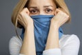 Cheerless female protecting herself from infection Royalty Free Stock Photo