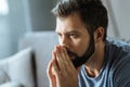 Cheerless handsome man feeling depressed Royalty Free Stock Photo