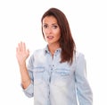 Cheerless lovely woman with hand up greeting Royalty Free Stock Photo