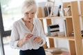 Cheerless moody woman holding pills