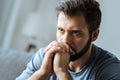 Cheerless thoughtful man feeling lonely Royalty Free Stock Photo