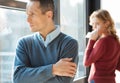 Cheerless unhappy man having a quarrel with his wife Royalty Free Stock Photo