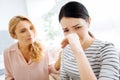 Cheerless unhappy woman wiping her nose