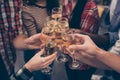 Cheers! Close up of best friends clinking with glasses of wine holding hands cheers toast sparkling beverage celebration. Beautifu Royalty Free Stock Photo