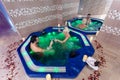 Cheers! Couple relaxing in jacuzzi and drinking wine at health spa stock photo Royalty Free Stock Photo