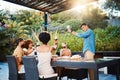 Cheers, group of friends at dinner in garden at party and celebration with diversity, food and wine at outdoor party