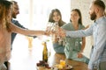 People clinking glasses with wine or champagne. Happy cheerful friends celebrate holidays, meeting. Close up shot of Royalty Free Stock Photo