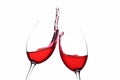 Cheers. A Toast with Red Wine. Splash. Royalty Free Stock Photo