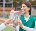 Cheers, water bottle and woman with hockey team on break together at sports training, match or competition. Smile