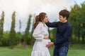 Cheertul married couple is expecting a baby. man embraces his pregnant wife in park Royalty Free Stock Photo