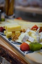 Cheese aperitif on a rustic table Royalty Free Stock Photo