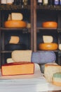 Cheese assortment. Coloured gouda and parmesan cheese at grocery