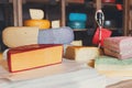 Cheese assortment. Coloured gouda and parmesan cheese at grocery