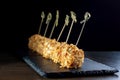 Cheese balls in breading, with natural bamboo skewers. Royalty Free Stock Photo