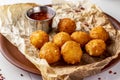 Cheese balls and tomato sauce, beer snack, horizontal photo Royalty Free Stock Photo