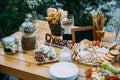 Cheese bar of several kinds of cheese, snacks, honey, nuts decorated on wooden table at the wedding party. Concept of