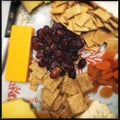 Cheese biscuits and fruit on plate Royalty Free Stock Photo
