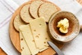 Cheese and biscuits snack of oat cakes with butter and emmental cheese on a board Royalty Free Stock Photo