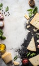 Cheese on black board with spices on rustic background Royalty Free Stock Photo