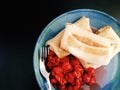 Cheese blinchiki/crepes on a plate with sour cherries Royalty Free Stock Photo