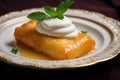 cheese blintz garnished with a dollop of sour cream