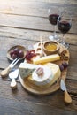 Cheese board with camembert cheese, parmesan cheese, maasdam cheese.