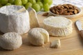 Cheese board with French Chaource cheese , Pico goat cheese and Crottin de chevre cheese Royalty Free Stock Photo