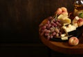 cheese board and fresh fruit grapes Royalty Free Stock Photo