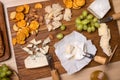 Cheese board. Various types of cheese. Cheese plate with cheeses Parmesan, Brie, Camembert and Roquefort serving on wooden board Royalty Free Stock Photo