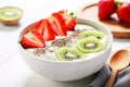 Cheese bowl with delicious cheese with strawberries, kiwi slices and chia seeds Royalty Free Stock Photo