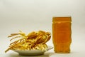 Cheese braid with beer on a light background