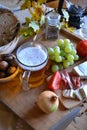 Cheese, bread, onions, wine, tomatoes and beer Royalty Free Stock Photo