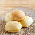 Cheese bread (pao de queijo) brazilian snack on sackcloth on woo