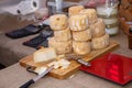 Cheese in bulk at market counter Royalty Free Stock Photo