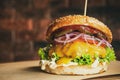 Cheese Burger on Wooden Board. Brick Wall Copyspace Background. American BBQ Beef Food Royalty Free Stock Photo