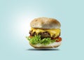 Cheese Burgers. Bun bread filled with lettuce, melting cheese, tomato slices, bacon, beef, onions, cheese mayonnaise. Isolated on Royalty Free Stock Photo
