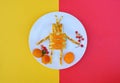 Cheese cake with fruits in shape of robot. Funny dish for Kids. Creative idea for breakfast. Snack time. Lunch idea. Royalty Free Stock Photo