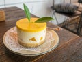 cheese cake with mango in side on a wooden table Royalty Free Stock Photo