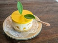 cheese cake with mango in side on a wooden table Royalty Free Stock Photo