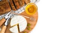 Cheese Camembert, crispy baguette and honey on the table. French breakfast. Close-up. Top view. Copy space. Selective focus Royalty Free Stock Photo