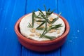 Cheese camembert with nuts and rosemary in ceramic dish Royalty Free Stock Photo
