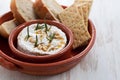 Cheese camembert with nuts and rosemary in ceramic dish Royalty Free Stock Photo